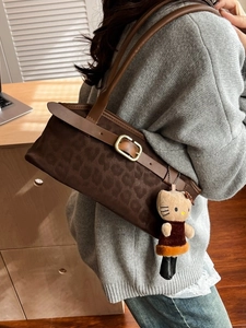 Retro brown leopard print shoulder bag in suede finish with a decorative gold buckle