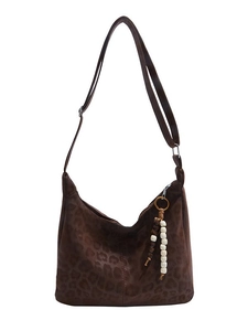 Brown leopard print suede hobo bag with adjustable wide strap and beaded pendant
