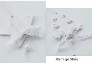 Detail of vintage white wood star and tree ornaments with lace bows and pearls