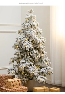 Detail of 135cm snowy PE Christmas tree with warm LED lights and a stylish pot base