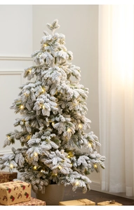Detail of 135cm flocked snow Christmas tree with warm LED lights in a grey pot