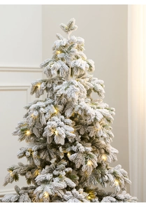 Detail of 135cm snowy Christmas tree with warm LED lights and flocked PE needles