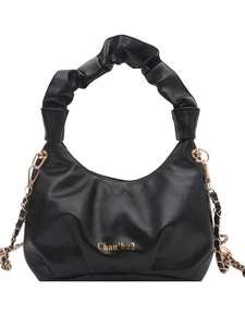 Retro black crossbody bag with pleated handle and golden chain strap on white background