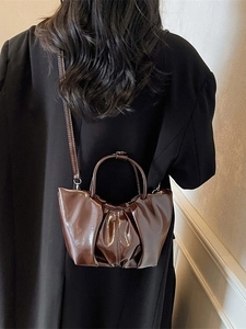 Fashionable brown pleated cloud bag with shiny leather finish and top handle for women