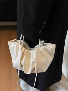 Chic cream white pleated cloud bag with soft leather texture and elegant silver hardware