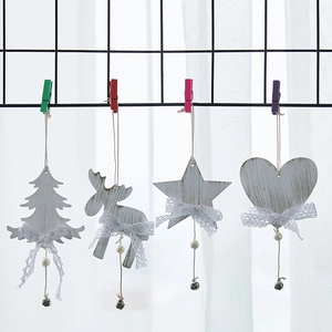White wood Christmas ornaments set with lace bows and bells for tree decoration