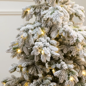 135cm pre-lit snowy artificial PE Christmas tree with warm LED lights and potted base