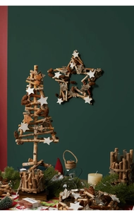 Macro shot of Nordic wooden star ornament with natural pine cones and rustic textures