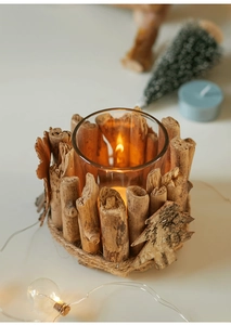 Macro detail of a natural wood log candle holder with rustic twine and tree ornament