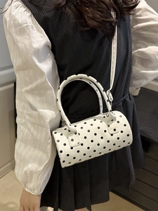 Stylish white polka dot cylinder handbag for women with dual handles and crossbody strap