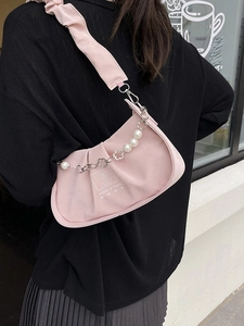 Pink pleated crossbody bag with pearl bead chain and stylish heart pattern for women