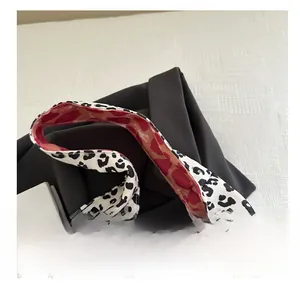 Detail view of the double-sided leopard print strap on the large canvas tote bag