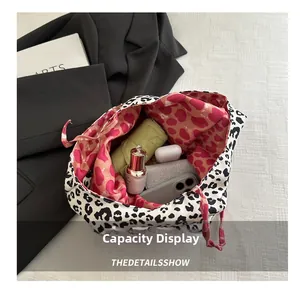 Spacious tote bag interior showing capacity for umbrella, phone, and cosmetics