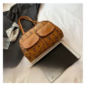Detail of vintage brown monogram bag with bear patterns and dual front flap pockets