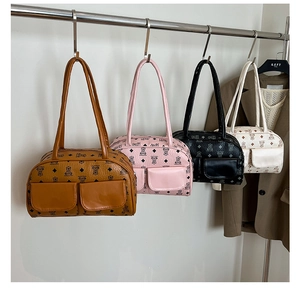 Detail showing vintage retro underarm bags in brown, pink, black and white color options