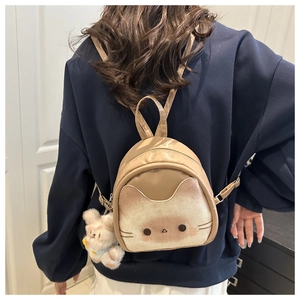 Mini khaki cartoon backpack with cute cat print and plush bunny charm on model back