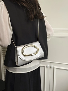 Silver matte box clutch bag with gold C-shaped metal clasp and elegant chain shoulder strap