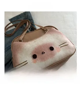 Detail showing the cute toast cat embroidery on light brown synthetic leather crossbody bag