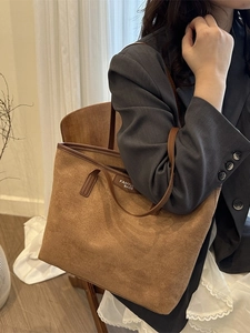 Brown faux suede large capacity tote bag with dark leather handles for daily casual use