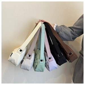Detailed close-up of six colorful nylon crossbody bags with adjustable straps and ruching