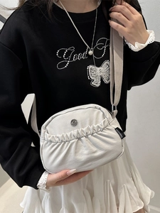 Chic cream white crossbody bag with pleated texture and adjustable wide strap