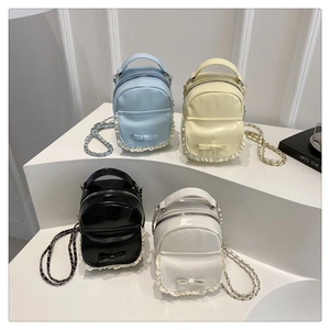 Mini high-gloss leather backpacks with bow, lace trim and chain straps in four colors