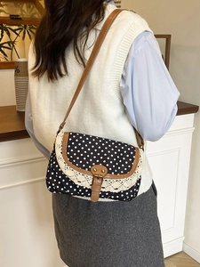 Vintage polka dot canvas crossbody bag with lace trim and adjustable leather strap