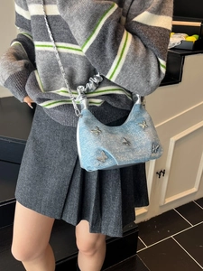 Blue denim Y2K handbag with sparkling rhinestones, silver butterfly charms and chain strap