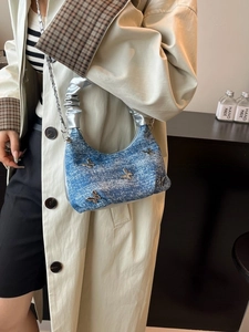 Blue denim Y2K handbag with silver butterfly charms and chic metallic pleated handle