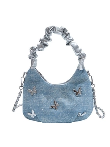 Blue denim half-moon handbag with silver butterfly accents and pleated handle