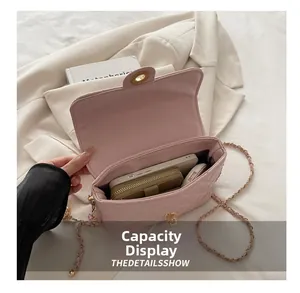 Pink quilted chain bag detail showing interior space for phone and wallet essentials
