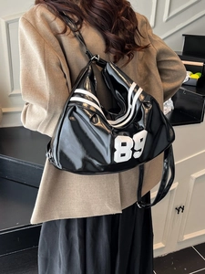Y2K style black glossy patent leather shoulder bag with white number 89 sports patch