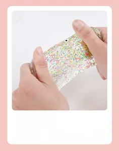Close-up of flexible koi fish squeeze toy filled with colorful sparkling sequins and glitter
