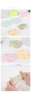 Detail of squishy fish toy showing colorful glitter filling and soft squeeze texture