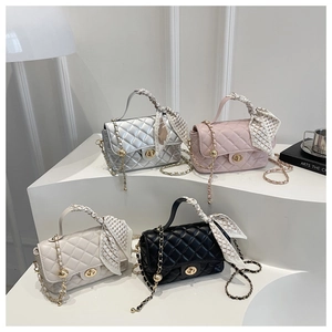 Detail of quilted crossbody bags with silk scarf handles and gold adjustable chain strap