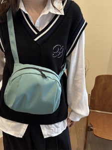 Minimalist mint green canvas shell crossbody bag for women with adjustable strap and zipper