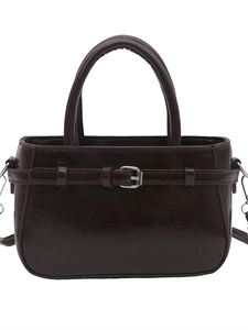 Dark brown glossy patent leather handbag with silver buckle and detachable shoulder strap