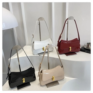 Glossy patent leather baguette bags in white, burgundy, black, and beige with metal locks