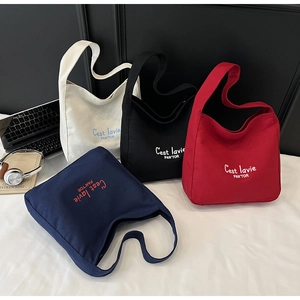 Detailed multi-color canvas tote bag selection featuring high-capacity design and letters