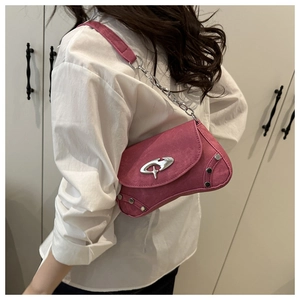 Detail of rose pink crossbody bag with silver studs and asymmetric metal buckle