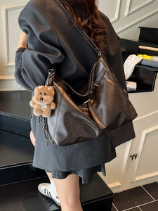 Retro black leather tote backpack with large capacity and cute plush bear charm