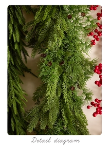 Close-up of Norfolk pine needles with natural pine cones and red berries for Christmas