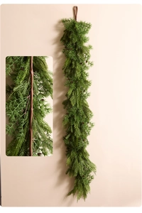 Detail of lush Norfolk pine garland with realistic needles and small brown pinecones