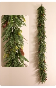 Close-up detail of Norfolk pine garland with soft needles and realistic pine cones