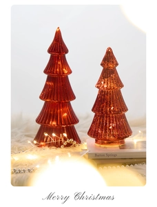Luminous glass Christmas tree set with vertical stripes on faux fur rug decor