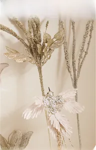 Detail of pink feather bird with pearls and champagne gold glitter leaves for decor