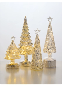 Detail of four champagne glass LED Christmas trees with mercury finish and warm glow