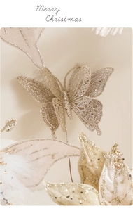 Detail of a sparkling champagne gold glitter butterfly pick for Christmas floral decor