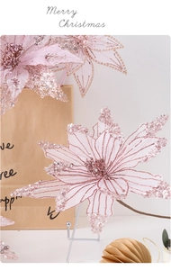 Detail of pink mesh Christmas flower with silver sequins and pearl accents on petals