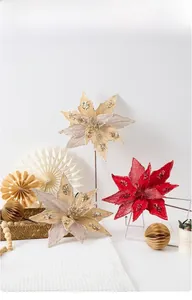 Detail of red and champagne artificial poinsettia flowers with sequins for Christmas decor